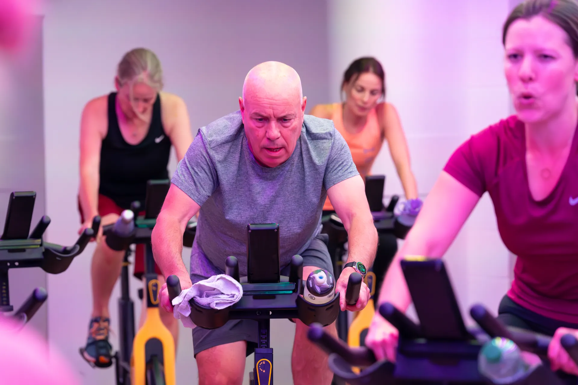 Older man in a spinning class
